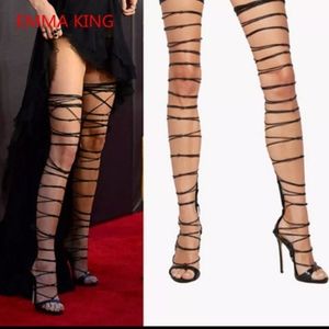 Head turning strappy boots by Emma King